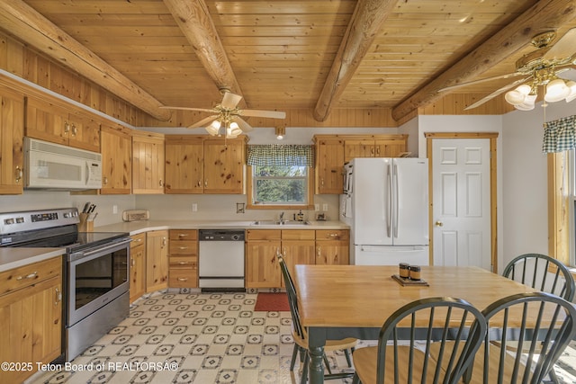 3320 Griffel Ct, Island Park, ID 83429 - kitchen featuring white appliances, a ceiling fan, light countertops, a wooden ceiling with exposed beams, and light flooring