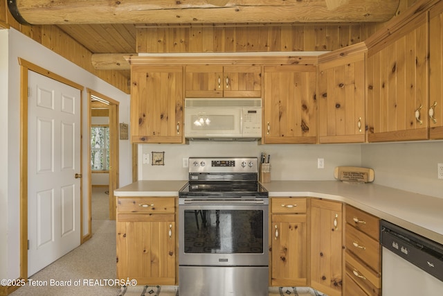 3320 Griffel Ct, Island Park, ID 83429 - kitchen featuring white microwave, stainless steel range with electric cooktop, dishwashing machine, light countertops, and beam ceiling