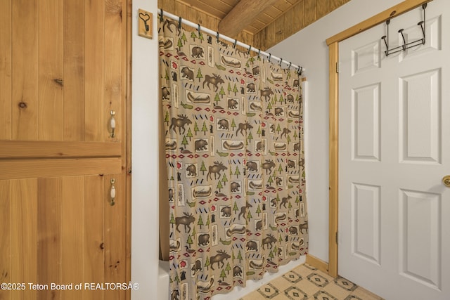 3320 Griffel Ct, Island Park, ID 83429 - full bathroom featuring tile patterned floors and shower / tub combo with curtain
