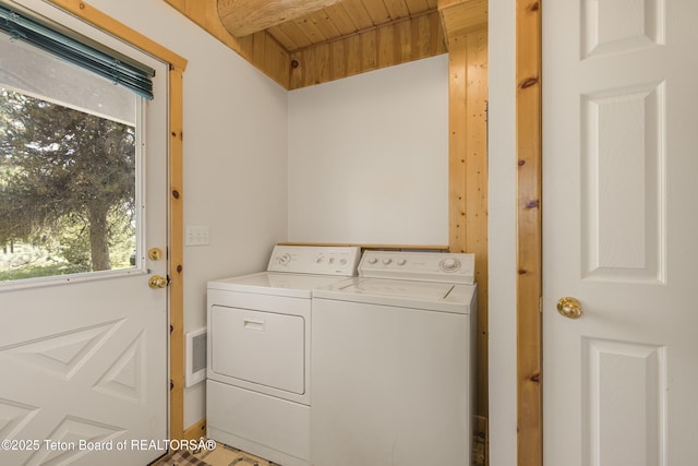 3320 Griffel Ct, Island Park, ID 83429 - laundry area featuring separate washer and dryer, plenty of natural light, and wood ceiling