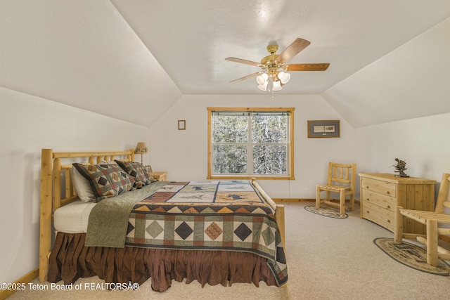 3320 Griffel Ct, Island Park, ID 83429 - carpeted bedroom featuring vaulted ceiling and a ceiling fan