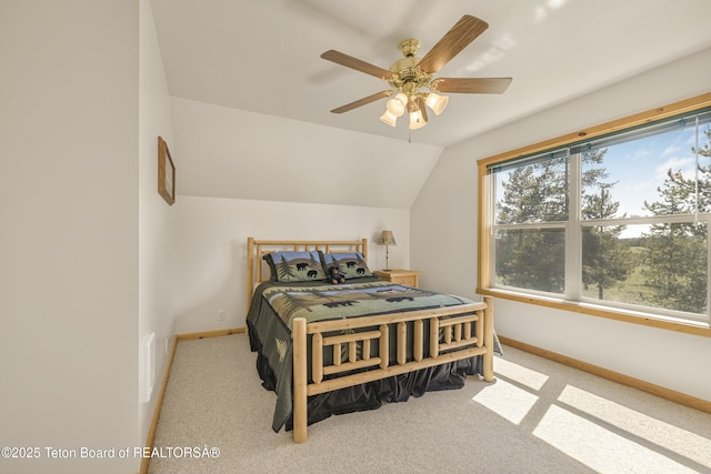 3320 Griffel Ct, Island Park, ID 83429 - carpeted bedroom with vaulted ceiling and a ceiling fan