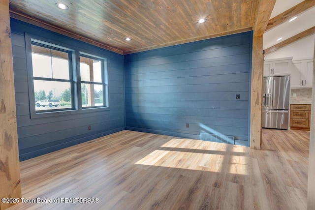 245 Pond Dr, Victor, ID 83455 - unfurnished room featuring wooden ceiling, light wood-type flooring, recessed lighting, and wood walls