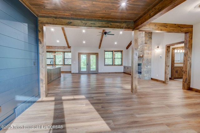 245 Pond Dr, Victor, ID 83455 - unfurnished living room featuring ceiling fan, a stone fireplace, light wood-style floors, and recessed lighting