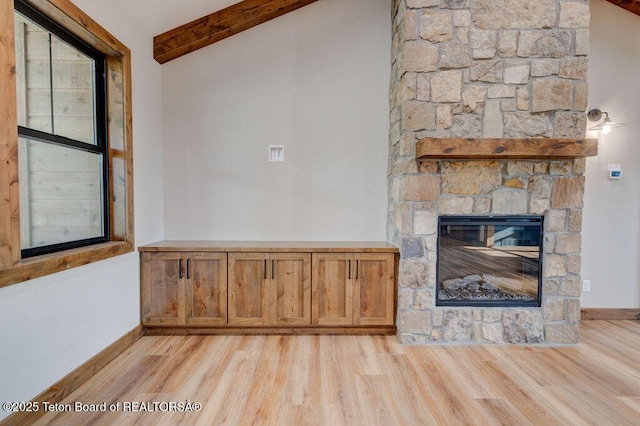 245 Pond Dr, Victor, ID 83455 - unfurnished living room featuring light wood-style flooring and a fireplace