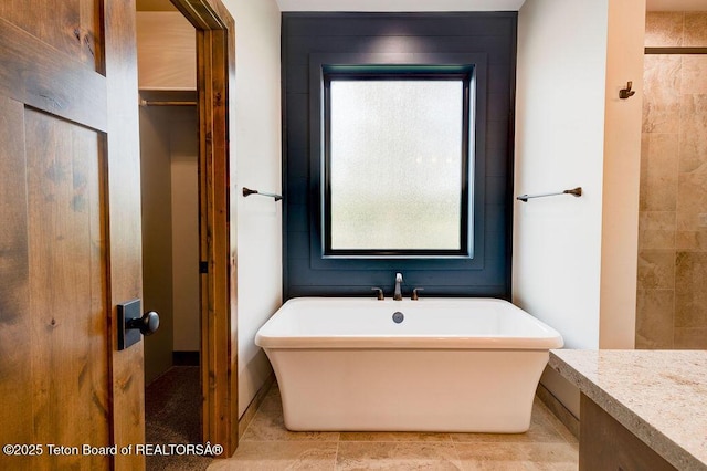 245 Pond Dr, Victor, ID 83455 - bathroom featuring a freestanding bath and vanity