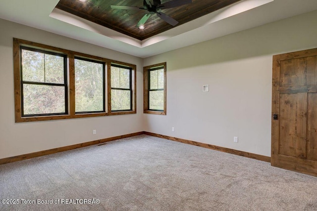 245 Pond Dr, Victor, ID 83455 - carpeted spare room with a raised ceiling, wooden ceiling, and ceiling fan