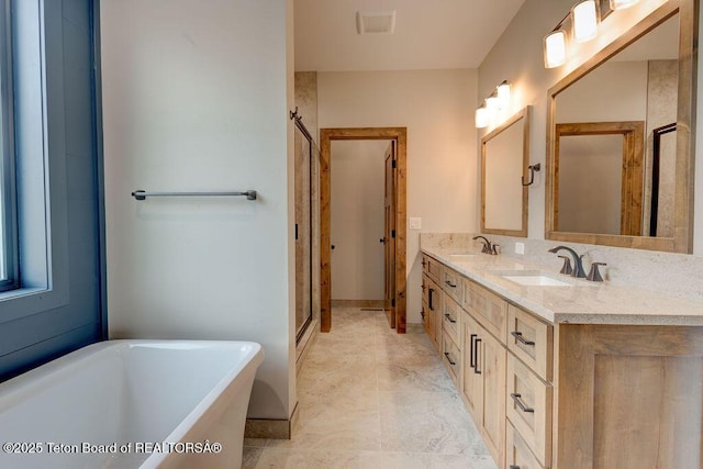 245 Pond Dr, Victor, ID 83455 - bathroom featuring a freestanding bath, double vanity, and a shower stall