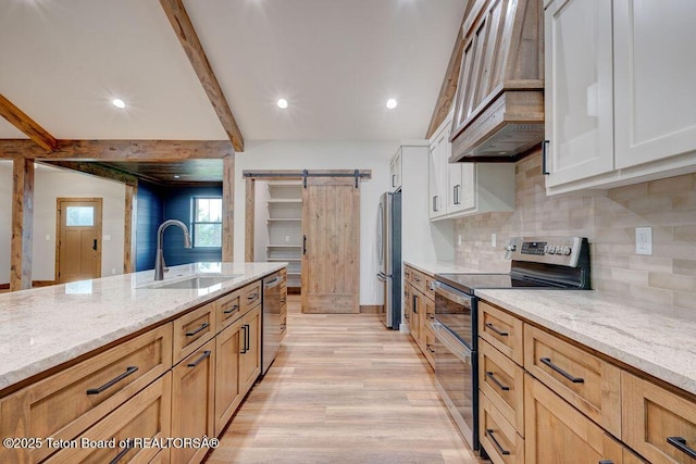 245 Pond Dr, Victor, ID 83455 - kitchen with appliances with stainless steel finishes, custom exhaust hood, light stone counters, beamed ceiling, and light wood-type flooring