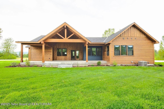 245 Pond Dr, Victor, ID 83455 - view of front of house featuring a front lawn and board and batten siding