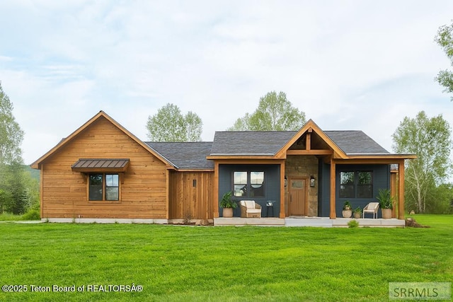 245 Pond Dr, Victor, ID 83455 - view of front of home featuring a front yard and covered porch