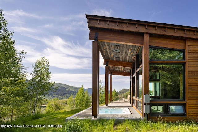 1955 W Bohnetts Rd, Jackson, WY 83001 - view of patio / terrace featuring a mountain view and a pool