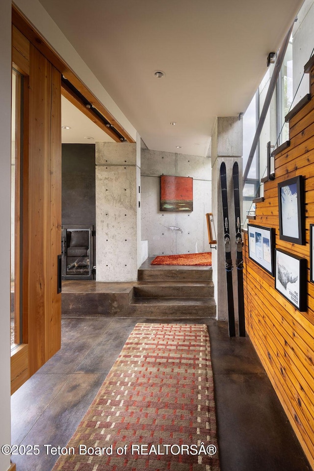 1955 W Bohnetts Rd, Jackson, WY 83001 - corridor with finished concrete floors, stairs, and wooden walls