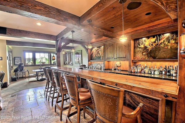 70 Hastings Dr, Victor, ID 83455 - indoor wet bar with stone tile flooring, recessed lighting, hanging light fixtures, and a wood ceiling with exposed beams