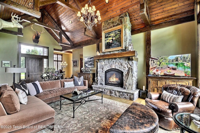 70 Hastings Dr, Victor, ID 83455 - living room with a wood ceiling with exposed beams, wood finished floors, high vaulted ceiling, a chandelier, and a fireplace