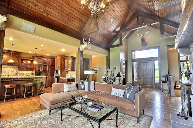 70 Hastings Dr, Victor, ID 83455 - living area with high vaulted ceiling, light wood-type flooring, a chandelier, recessed lighting, and a wood ceiling with exposed beams