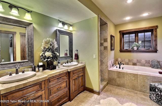 70 Hastings Dr, Victor, ID 83455 - bathroom featuring double vanity, tile patterned flooring, a bath, and tiled shower