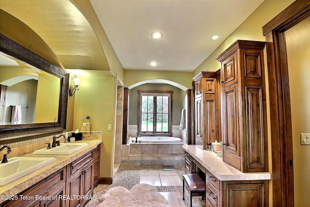 70 Hastings Dr, Victor, ID 83455 - full bathroom featuring a garden tub, double vanity, recessed lighting, tile patterned flooring, and tasteful backsplash