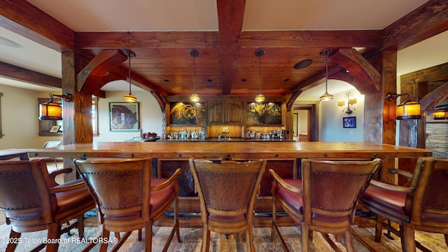 70 Hastings Dr, Victor, ID 83455 - indoor dry bar with arched walkways, a wood ceiling with exposed beams, and hanging light fixtures