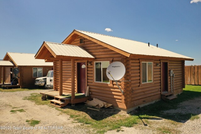 4760 W 500 W, Victor, ID 83455 - log home with log siding and a metal roof