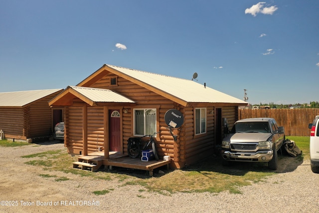 4760 W 500 W, Victor, ID 83455 - cabin featuring log siding and a metal roof