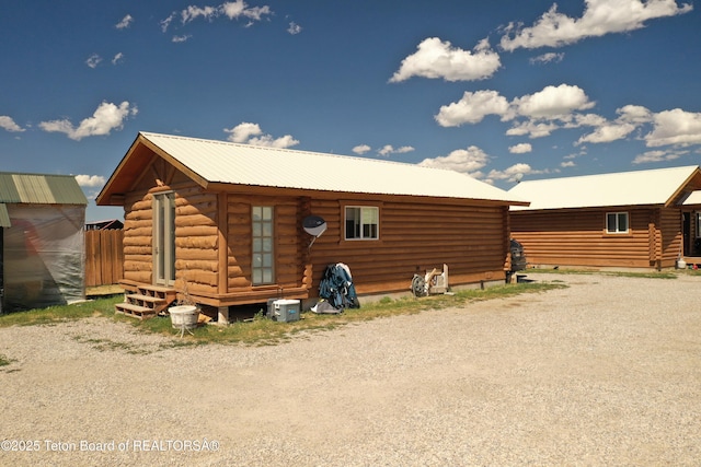 4760 W 500 W, Victor, ID 83455 - back of property featuring log exterior and a metal roof