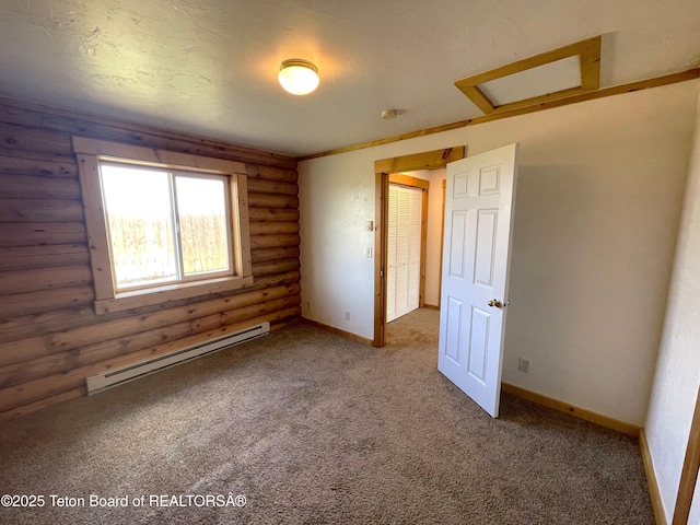 4760 W 500 W, Victor, ID 83455 - spare room featuring rustic walls, a baseboard heating unit, attic access, carpet flooring, and a smoke detector