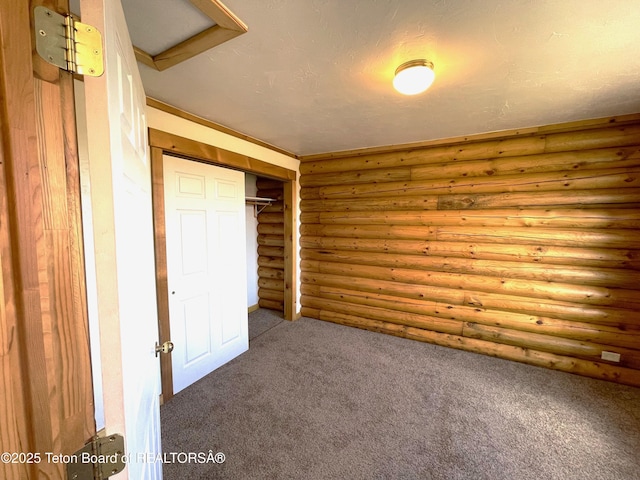 4760 W 500 W, Victor, ID 83455 - unfurnished bedroom with carpet, rustic walls, and a closet