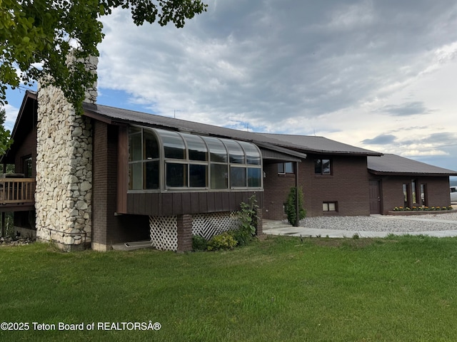 13280 N 3750 W, Felt, ID 83424 - back of house with a chimney, a yard, and brick siding