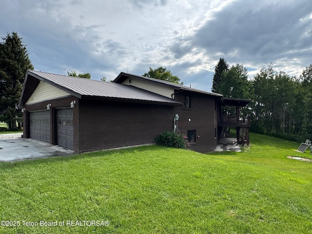 13280 N 3750 W, Felt, ID 83424 - view of home's exterior with brick siding, a garage, a yard, stairs, and a wooden deck