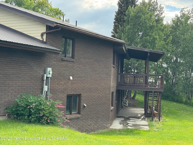 13280 N 3750 W, Felt, ID 83424 - view of property exterior with stairs, a lawn, a deck, a patio area, and brick siding