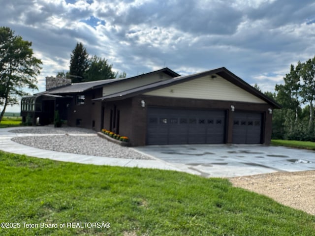 13280 N 3750 W, Felt, ID 83424 - view of front of property with concrete driveway, an attached garage, and a front lawn