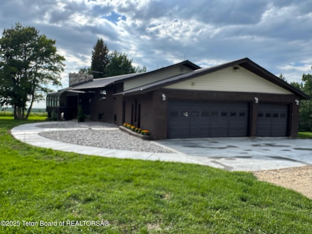 13280 N 3750 W, Felt, ID 83424 - view of front of home with concrete driveway, an attached garage, a front yard, and a chimney