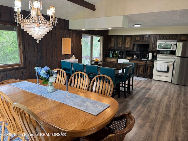 13280 N 3750 W, Felt, ID 83424 - dining room with a chandelier, wood finished floors, wood walls, and a textured ceiling