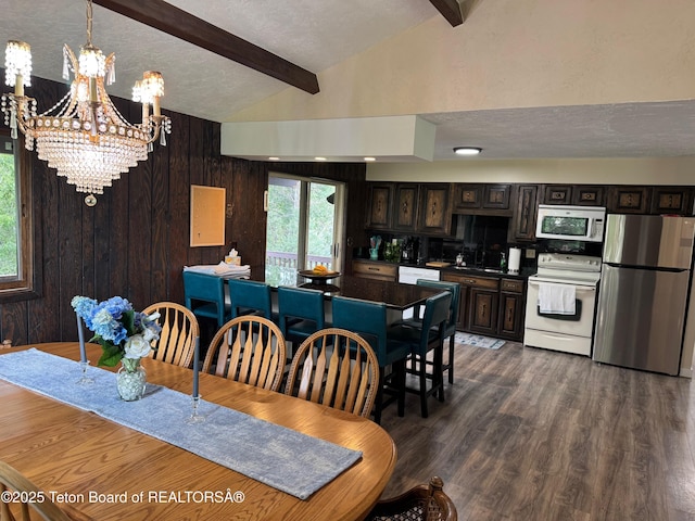13280 N 3750 W, Felt, ID 83424 - dining room featuring a chandelier, dark wood-style floors, a textured ceiling, and wood walls