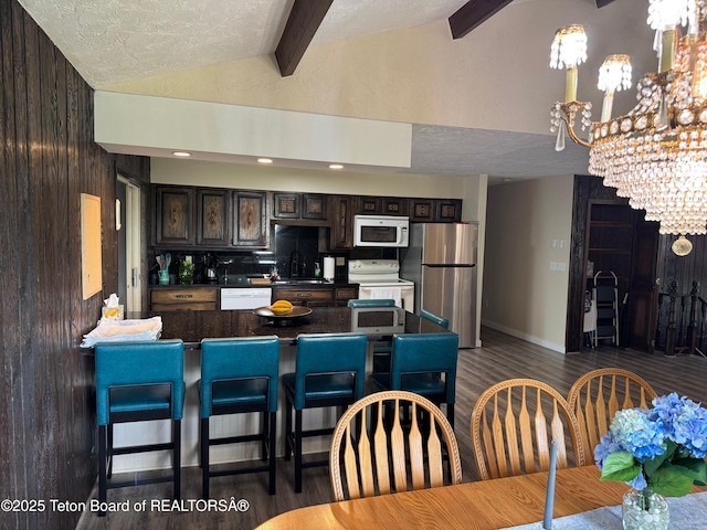 13280 N 3750 W, Felt, ID 83424 - dining area with a chandelier, dark wood-style floors, and a textured ceiling
