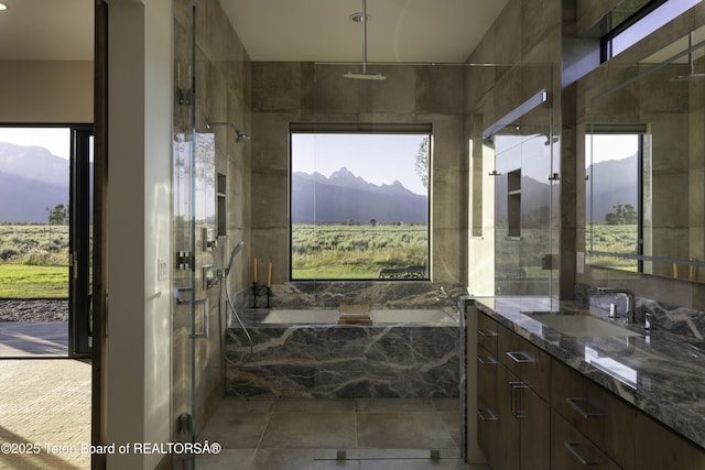 580 Moulton Loop Rd, Jackson, WY 83001 - bathroom with a mountain view, plenty of natural light, vanity, and a garden tub