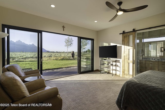 580 Moulton Loop Rd, Jackson, WY 83001 - carpeted bedroom with access to exterior, a barn door, recessed lighting, ensuite bath, and a ceiling fan