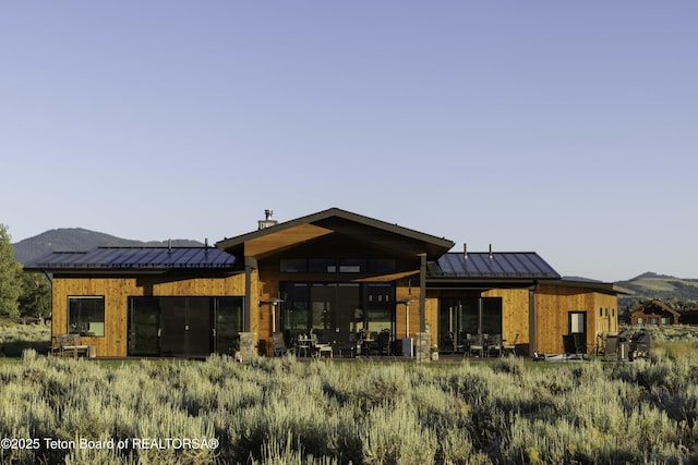 580 Moulton Loop Rd, Jackson, WY 83001 - back of house featuring a standing seam roof, a metal roof, and a mountain view