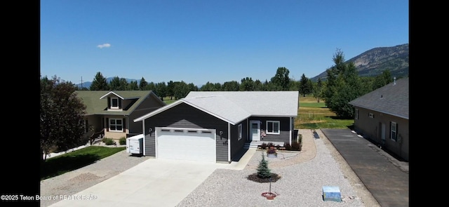 643 Country Club Way, Thayne, WY 83127 - view of front of property featuring concrete driveway and a garage