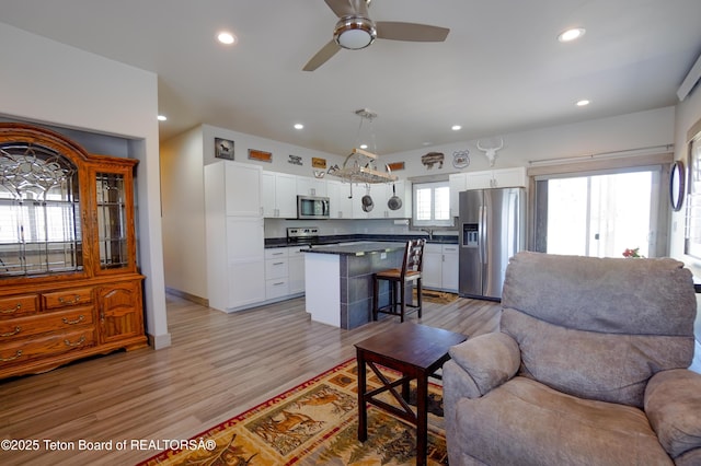643 Country Club Way, Thayne, WY 83127 - living area featuring recessed lighting, ceiling fan, and light wood-style floors