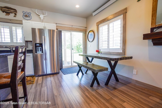 643 Country Club Way, Thayne, WY 83127 - dining area with wood finished floors and recessed lighting