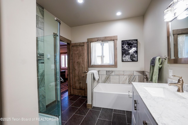 643 Country Club Way, Thayne, WY 83127 - bathroom with vanity, a bath, a shower stall, recessed lighting, and tile patterned flooring