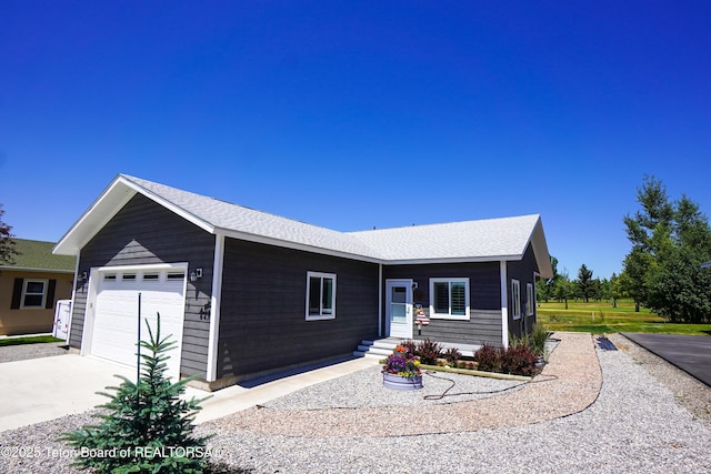 643 Country Club Way, Thayne, WY 83127 - ranch-style home featuring an attached garage, concrete driveway, and roof with shingles
