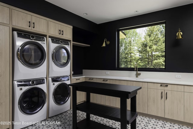 175 Huckleberry Dr, Jackson, WY 83001 - laundry room with estacked washer and dryer, cabinet space, light floors, and separate washer and dryer