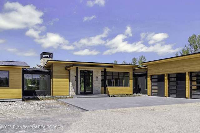 175 Huckleberry Dr, Jackson, WY 83001 - view of building exterior featuring a garage