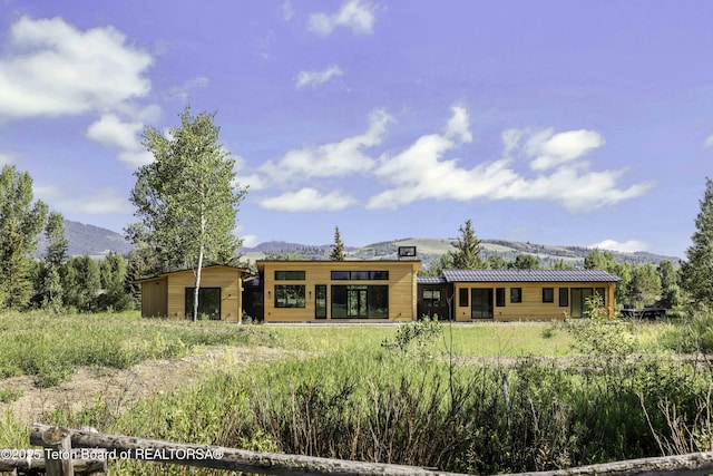 175 Huckleberry Dr, Jackson, WY 83001 - rear view of house featuring a mountain view