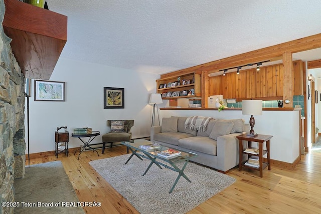 4435 Berry Dr Unit 3611, Wilson, WY 83014 - living area with hardwood / wood-style flooring, rail lighting, and a textured ceiling
