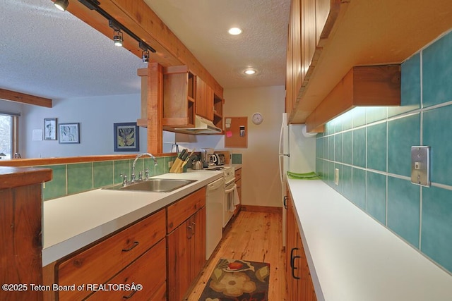 4435 Berry Dr Unit 3611, Wilson, WY 83014 - kitchen featuring a textured ceiling, light wood-style flooring, recessed lighting, dishwasher, and light countertops