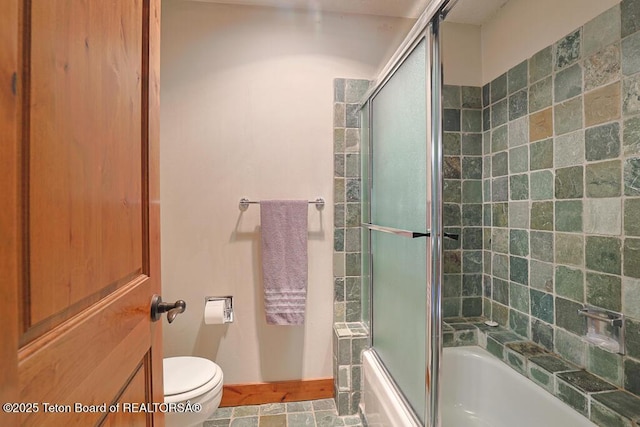 4435 Berry Dr Unit 3611, Wilson, WY 83014 - bathroom featuring toilet and enclosed tub / shower combo